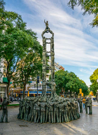 TARRAGONA, SPAIN, DECEMBER 29, 2015: People are passing by the Castellers monument from the catalan...
