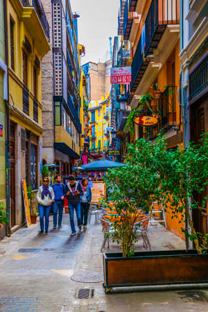 VALENCIA, SPAIN, DECEMBER 30, 2015: View of a narrow street situated in the historical center of spanish city Valenciaのeditorial素材