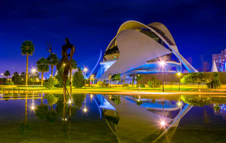 VALENCIA, SPAIN, DECEMBER 31, 2015: View of the palau de les arts reina sofia concert hall in spanish city valencia is reflected on a pond in the turia gardens during nightのeditorial素材