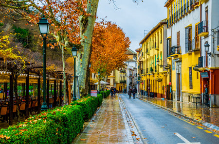 GRANADA, SPAIN, JANUARY 3, 2016: View of a street with bars and restaurants situated on riverside of river darro in spanish city granadaのeditorial素材