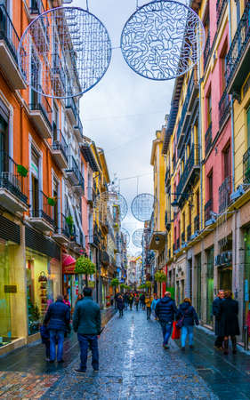 GRANADA, SPAIN, JANUARY 3, 2016: View of souvenir shops stretching alongside the way to the alhambra palace in spain.のeditorial素材