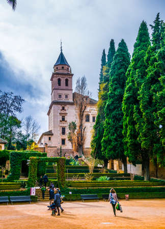 GRANADA, SPAIN, JANUARY 3, 2016: People are strolling thourgh park grounds of the alhambra palace in spainのeditorial素材