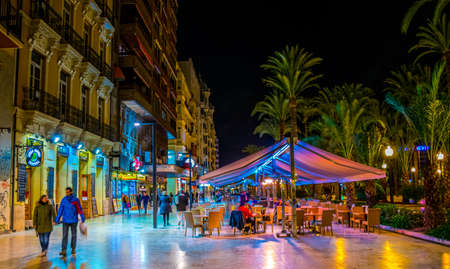 ALICANTE, SPAIN, JANUARY 2, 2016: Night view of illuminated promenade in spanish city Alicante, which is streteched alongside the mediterranean sea.のeditorial素材