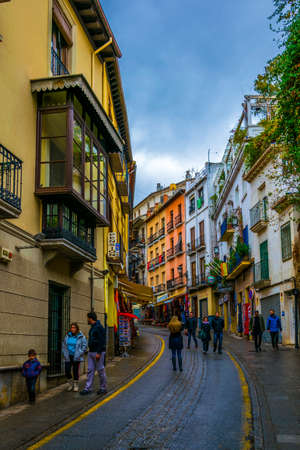 GRANADA, SPAIN, JANUARY 3, 2016: View of souvenir shops stretching alongside the way to the alhambra palace in spain.のeditorial素材