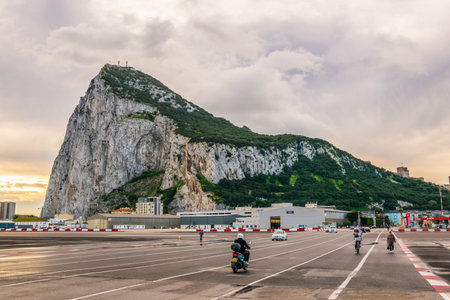 GIBRALTAR, GIBRALTAR, JANUARY 5, 2016: people are crossing border between spain and gibraltar during early morningのeditorial素材