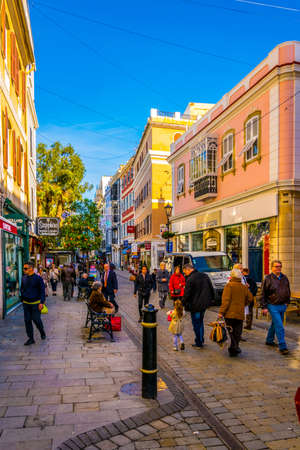 GIBRALTAR, GIBRALTAR, JANUARY 5, 2016: people are strolling through a narrow street of Gibraltarのeditorial素材