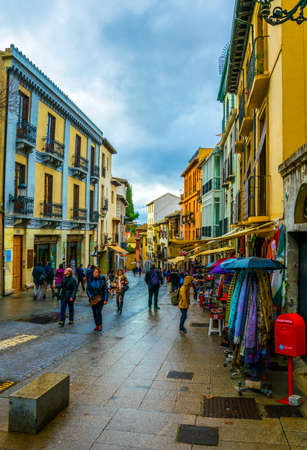 GRANADA, SPAIN, JANUARY 3, 2016: View of souvenir shops stretching alongside the way to the alhambra palace in spain.のeditorial素材