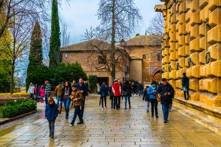 GRANADA, SPAIN, JANUARY 3, 2016: People are strolling thourgh park grounds of the alhambra palace in spainのeditorial素材
