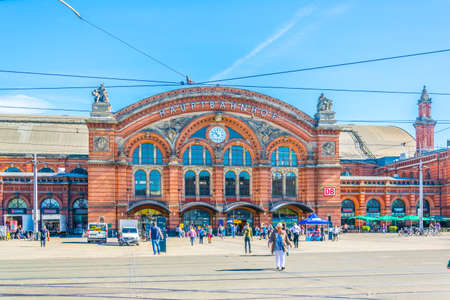 BREMEN, GERMANY, AUGUST 30, 2016: people are walking in front of the bremen main railway station in...