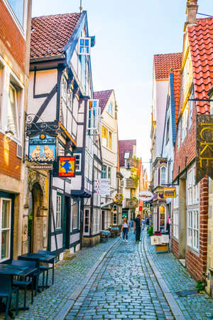 Photo for BREMEN, GERMANY, AUGUST 30, 2016: People are strolling through Schnoor district in Bremen, Germany. - Royalty Free Image