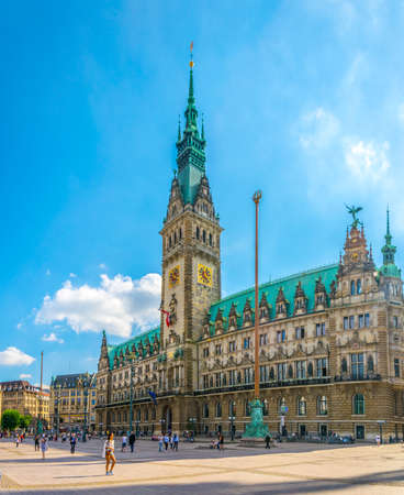 HAMBURG, GERMANY, AUGUST 29, 2016: people are walking in front of the hamburg town hall in Germany.のeditorial素材