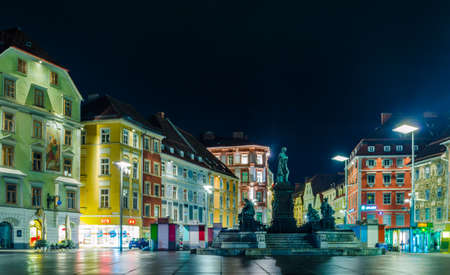 GRAZ, AUSTRIA - JULY 30, 2015: night view of illuminated buildings stretched alonside of the rathauspaltz in the austrian city graz.のeditorial素材