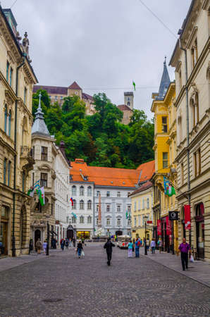 LJUBLJANA, SLOVENIA, JULY 29, 2015: Stritarjeva street is one of the major pedestrian route for tourists. From the street people may admire ljubljana castle perched on the hill behind it.のeditorial素材