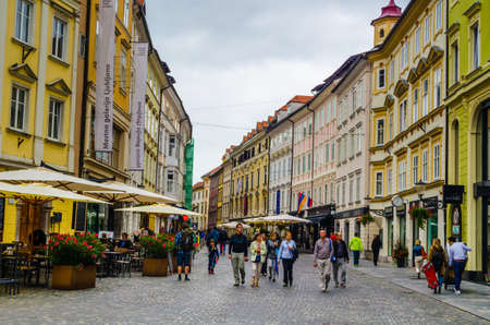 LJUBLJANA, SLOVENIA, JULY 29, 2015: View of the stari trg street in slovenian capital ljubljana, which stretches thourgh the heart of the old town and is full of restaurants.のeditorial素材