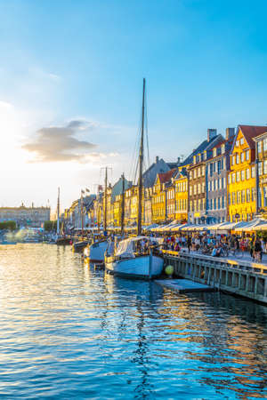 COPENHAGEN, DENMARK, AUGUST 21, 2016: Sunset view of old Nyhavn port in the central Copenhagen, Denmark.のeditorial素材