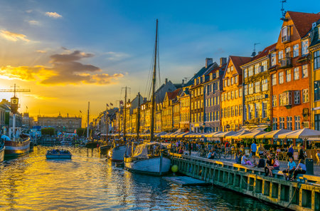 COPENHAGEN, DENMARK, AUGUST 21, 2016: Sunset view of old Nyhavn port in the central Copenhagen, Denmark.のeditorial素材