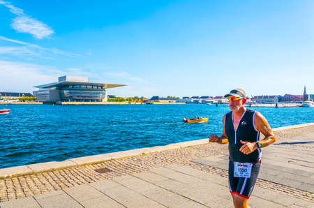 COPENHAGEN, DENMARK, AUGUST 21, 2016: Detail of an athlete participating at the 2016 KMD Ironman triatlon competition in Copenhagen.のeditorial素材