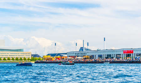 COPENHAGEN, DENMARK, AUGUST 21, 2016: Copenhagen Street Food Market Papiroen and the opera house.のeditorial素材