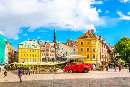RIGA, LATVIA, AUGUST 15, 2016: People are strolling through Doma Laukums square full of restaurants in the Latvian capital Riga.のeditorial素材