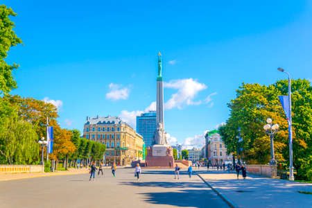 RIGA, LATVIA, AUGUST 15, 2016: People are walking next to the Freedom monument in Riga, Latvia.のeditorial素材