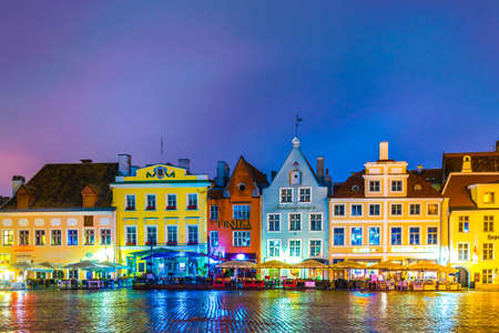 TALLIN, ESTONIA, AUGUST 16, 2016: Night view of restaurants surrounding the town hall square in the old town of Tallin, Estonia.のeditorial素材