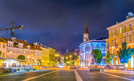 VILNIUS, LITHUANIA, AUGUST 14, 2016: Night view of People strolling through Rotuses aikste - the town hall square of the lithuanian capital Vilnius, Lithuaniaのeditorial素材