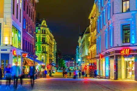 OSLO, NORWAY, AUGUST 24, 2016: People are strolling on a street during night in Oslo, the capital of Norwayのeditorial素材