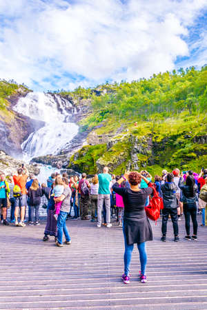 BERGEN, NORWAY, AUGUST 23, 2016: People are watching Kjosfossen waterfall from the flam railway in norway.のeditorial素材