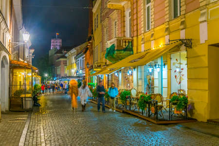 VILNIUS, LITHUANIA, AUGUST 14, 2016: Night view of the Pilies gatve which is the main tourist street in Vilnius, Lithuaniaのeditorial素材