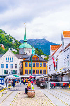 BERGEN, NORWAY, AUGUST 22, 2016: People are passing through city center of the norwegian city Bergen.のeditorial素材