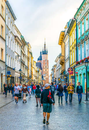 KRAKOW, POLAND, AUGUST 11, 2016: People are walking through Florianska street towards the saint Mary church in Krakow / Cracow, Poland.のeditorial素材