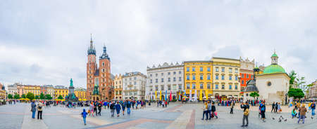 KRAKOW, POLAND, AUGUST 11, 2016: Panorama of the rynek glowny main square with the church of Saint Mary and church of Saint Adalbert in the polish city Cracow / Krakow.のeditorial素材