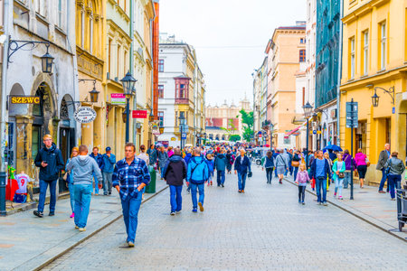 KRAKOW, POLAND, AUGUST 11, 2016: People are walking through Grodzka street in Krakow / Cracow, Poland.のeditorial素材
