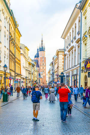 KRAKOW, POLAND, AUGUST 11, 2016: People are walking through Florianska street towards the saint Mary church in Krakow / Cracow, Poland.のeditorial素材