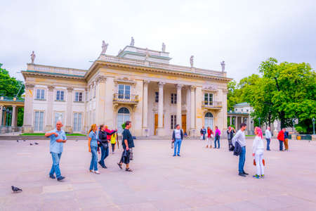 WARSAW, POLAND, AUGUST 13, 2016: people are strolling in front of the Palace on the Water, also called Lazienki Palace or Palace on the Isle in Lazienki Royal Park, Warsaw, Polandのeditorial素材