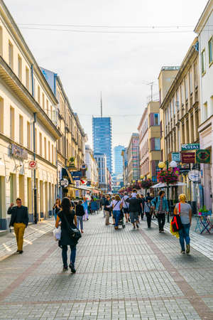 WARSAW, POLAND, AUGUST 12, 2016: People are strolling through the nowy swiat street in Warsaw, Polandのeditorial素材