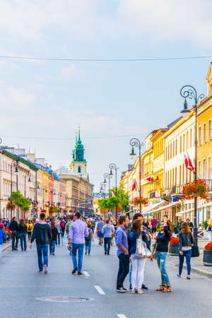 WARSAW, POLAND, AUGUST 12, 2016: People are strolling through the nowy swiat street in Warsaw, Polandのeditorial素材