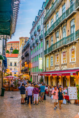 LISBON, PORTUGAL, SEPTEMBER 3, 2016: People are passing through a minor street near rua augusta in Lisbon, Portugal.のeditorial素材
