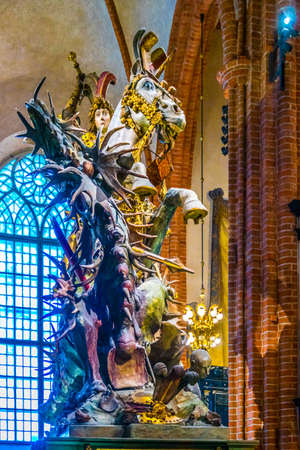 STOCKHOLM, SWEDEN, AUGUST 18, 2016: The most famous wooden statue of Saint George and the Dragon inside of the Storkyrkan church in Gamla Stan, Stockholm, Sweden.のeditorial素材