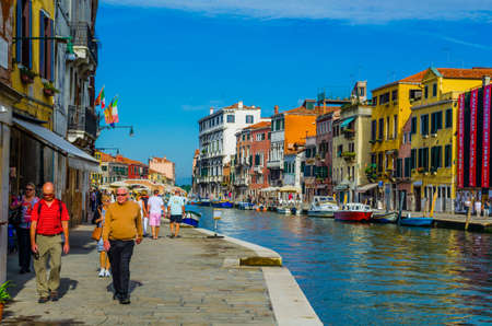 VENICE, ITALY, SEPTEMBER 20, 2015: view of a minor channel with few boats swinging on ripples in Venice, italyのeditorial素材