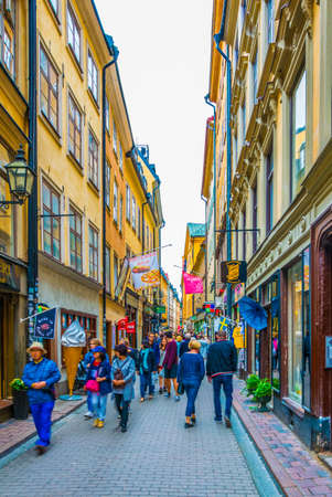 STOCKHOLM, SWEDEN, AUGUST 19, 2016: People are strolling on a street in the Gamla Stan district in central Stockholm, Sweden.のeditorial素材