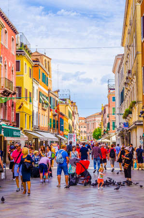 VENICE, ITALY, SEPTEMBER 20, 2015: people are strolling over strada nuova street in italian city...