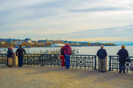 ZURICH, SWITZERLAND, OCTOBER 24, 2015: People are admiring zurich lake from the viewpoint with famous ganimede statueのeditorial素材