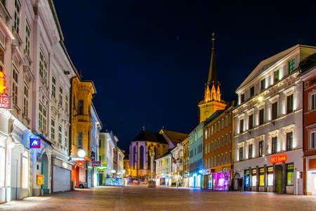 VILLACH, AUSTRIA, FEBRUARY 20, 2016: night view of the illuminated main square - main square with the church of saint jakob in the austrian city villachのeditorial素材