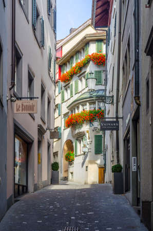 ZURICH, SWITZERLAND, OCTOBER 24, 2015: View of a narrow street winding through the historical center of zurich in switzerlandのeditorial素材