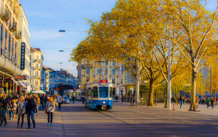 ZURICH, SWITZERLAND, OCTOBER 24, 2015: People are passing by Sechsenlautenplatz in the swiss city zurich which is dominated by the majestic building of opera.のeditorial素材
