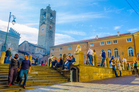 BERGAMO, ITALY, NOVEMBER 2, 2014: People are strolling through Piazza Vecchia in Bergamo, Italyのeditorial素材
