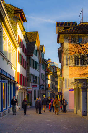 ZURICH, SWITZERLAND, OCTOBER 24, 2015: View of a narrow street winding through the historical center of zurich in switzerlandのeditorial素材