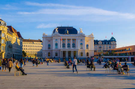 ZURICH, SWITZERLAND, OCTOBER 24, 2015: People are passing by Sechsenlautenplatz in the swiss city zurich which is dominated by the majestic building of opera.のeditorial素材