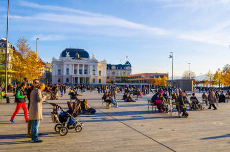 ZURICH, SWITZERLAND, OCTOBER 24, 2015: People are passing by Sechsenlautenplatz in the swiss city zurich which is dominated by the majestic building of opera.のeditorial素材